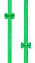 Two little green bow knots on two parallel ribbons Royalty Free Stock Photo