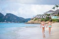 Two little happy girls have a lot of fun at tropical beach playing together Royalty Free Stock Photo