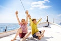 Two little kid boys, best friends enjoying sailing boat trip. Family vacations on ocean or sea on sunny day. Children Royalty Free Stock Photo