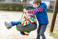 Two little kid boys having fun with chain swing on outdoor playground. Children, best friends and siblings swinging on Royalty Free Stock Photo