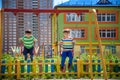 Two little kid boys having fun with swing on outdoor playground. Children, best friends and siblings swinging on warm sunny spring Royalty Free Stock Photo