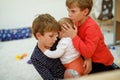 Two little kid boys hugging with newborn baby girl, cute sister. Royalty Free Stock Photo