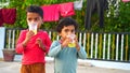 Little Asian kid with Lemon fruit juice. Boys enjoying with cold lemon fruitee with glass. Summer weather and drinks concept Royalty Free Stock Photo