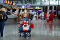 Two little kids, boy and girl and mother in medical mask at airport. Children, family travel by plane during corona Royalty Free Stock Photo