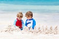 Two kid boys building sand castle on tropical beach of Playa del Carmen, Mexico Royalty Free Stock Photo