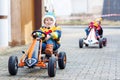 Two little kids boys having fun with toy race cars Royalty Free Stock Photo