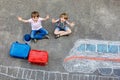 Two little kids boys having fun with train picture drawing with colorful chalks on asphalt. Children having fun with Royalty Free Stock Photo