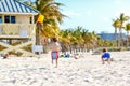 Two little kids boys having fun on tropical beach, happy best friends playing with sand, friendship concept. Siblings Royalty Free Stock Photo