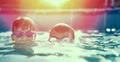 Two little kids in goggles swimming in pool at sunset