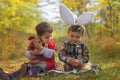 Two little kids playing like bunnies in the park Royalty Free Stock Photo