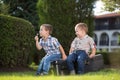 Two little kids playing outdoors