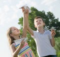 two little kids playing with simple paper planes Royalty Free Stock Photo