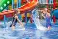 Two little kids playing in the swimming pool Royalty Free Stock Photo