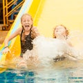 Two little kids playing in the swimming pool Royalty Free Stock Photo