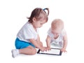 Two little kids playing with tablet computer Royalty Free Stock Photo