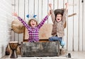 Two little laughing children with hands up Royalty Free Stock Photo