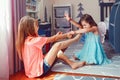 Two little mad angry girls sisters having fight at home. Friends girls can not share toy. Lifestyle authentic funny family moment Royalty Free Stock Photo