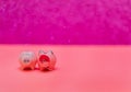 Two little pigs on a pink background. Composition for Valentine`s Day. Finance concept. Piggy bank, animals, figurines. Copy space Royalty Free Stock Photo
