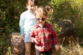 Two little preschooler girls in wild nature. Little children in the forest