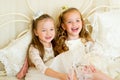 Two little princess on the bed Royalty Free Stock Photo