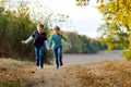 Two little school kids boys running and jumping in forest. Happy children, best friends and siblings having fun on warm Royalty Free Stock Photo