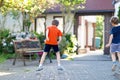 Two little school and preschool kids boys playing hopscotch on playground Royalty Free Stock Photo