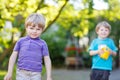 Two little sibling boys hugging and having fun outdoors Royalty Free Stock Photo