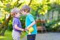 Two little sibling boys hugging and having fun outdoors Royalty Free Stock Photo