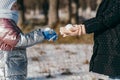 Two sisters of different ages on a winter walk in a snowy park Royalty Free Stock Photo