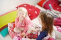 Two little sisters in bed on sunny morning Royalty Free Stock Photo