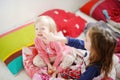 Two little sisters in bed on sunny morning Royalty Free Stock Photo