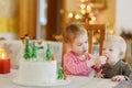 Two little sisters and a Christmas cake