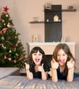 Two little sisters doing the ok sign Royalty Free Stock Photo