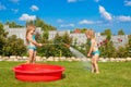 Two little sisters frolicing, splashing and having Royalty Free Stock Photo