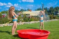 Two little sisters frolicing, splashing and having Royalty Free Stock Photo