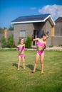 Two little sisters frolicing and splashing in Royalty Free Stock Photo