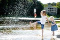 Two little sisters having fun by a river Royalty Free Stock Photo