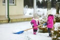 Two little sisters having fun on snowy winter day Royalty Free Stock Photo