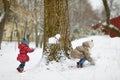 Two little sisters having fun on snowy winter day Royalty Free Stock Photo