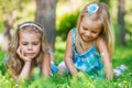 Two little sisters having fun in summer park Royalty Free Stock Photo