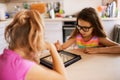 Two little sisters playing chess Royalty Free Stock Photo