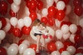 Two little sisters with red and white balloons Royalty Free Stock Photo