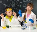 Two little students on chemistry lesson in lab