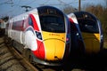 Two LNER Azuma Railway Trains Passing