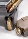 Two loaded 9mm pistol magazines with a loaded 223 caliber magazine