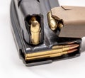 Two loaded 9mm pistol magazines with a loaded 223 caliber magazine