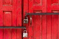 Two locks on an red door Royalty Free Stock Photo