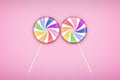 Two Lolipops candy on pastel pink background. Royalty Free Stock Photo