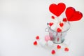Two Lollipops heart shaped in Small bucket with sweets on white Royalty Free Stock Photo