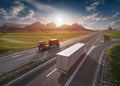 Two lone trucks on highway at idyllic sunny morning Royalty Free Stock Photo